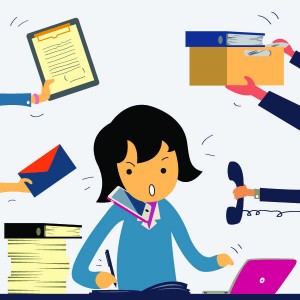 Very busy business woman working hard on her desk in office with a lot of paper work, talking on smart phone, and more tasks coming to her. Business concept on hard working.